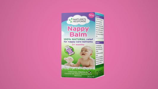 Natural nappy balm product box against a soft pink background—gentle care for sore baby bottoms