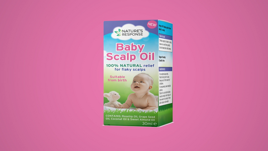 Natural baby scalp oil product box against a soft pink background—soothing care for dry or flaky scalps