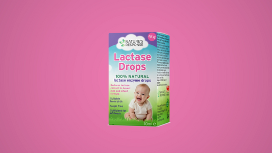 Natural lactase drops product box against a soft pink background—helps soothe and digest baby’s lactose intolerance